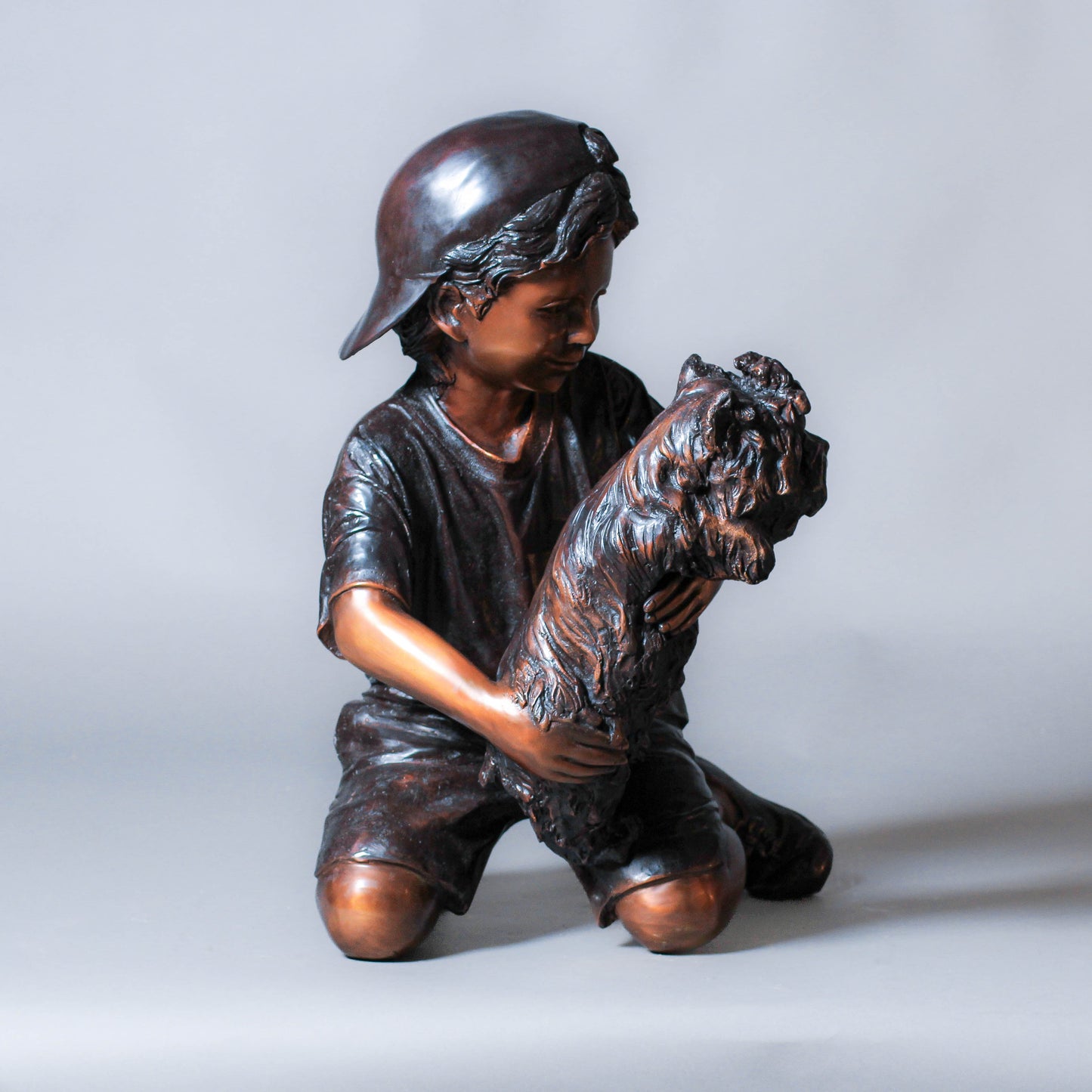 Boy Playing with a Dog Bronze Sculpture