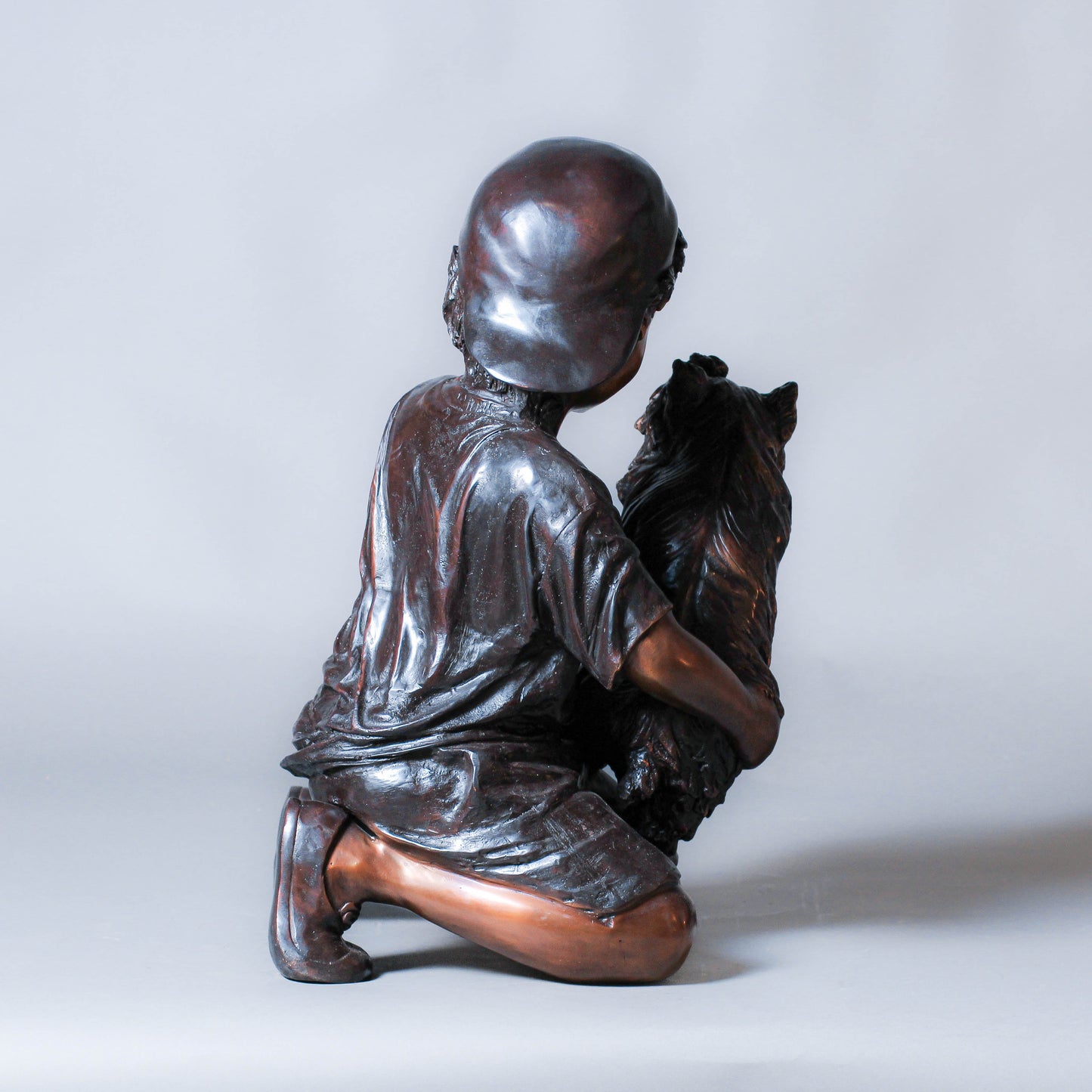 Boy Playing with a Dog Bronze Sculpture