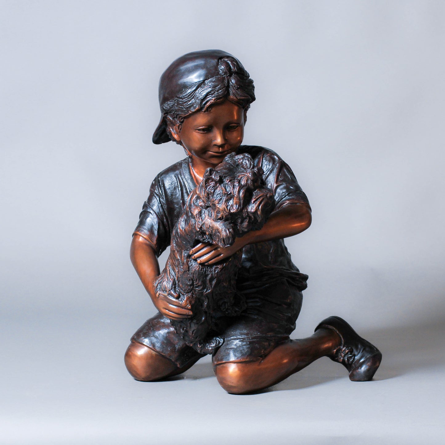 Boy Playing with a Dog Bronze Sculpture